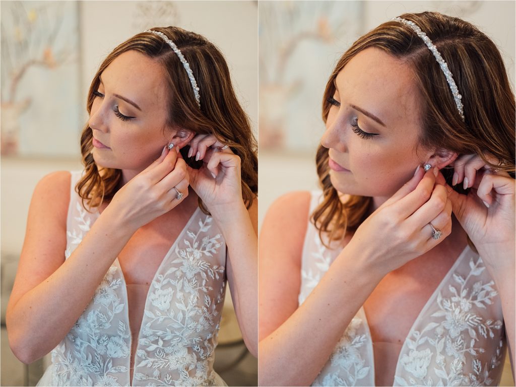 Close up of bride putting on earrings