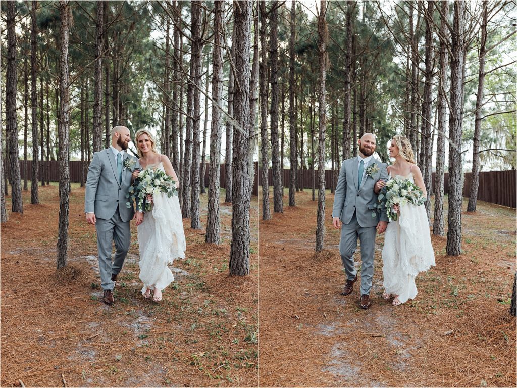 Bride and groom walking together under pine trees