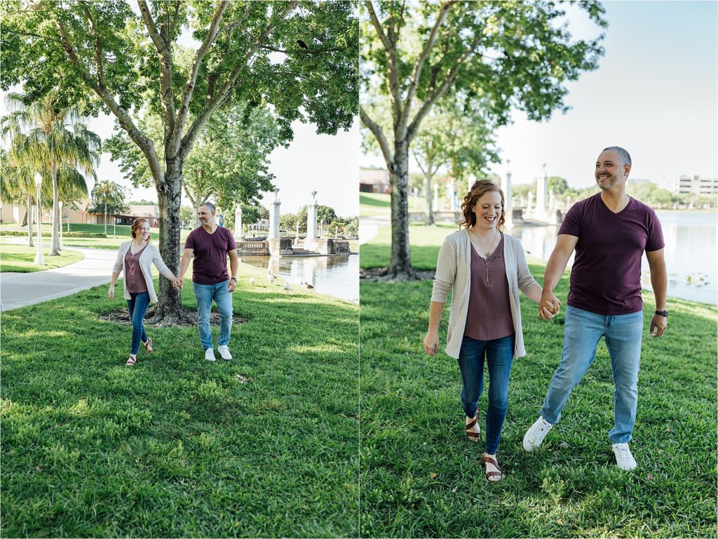 Couple holding hands and walking in the grass