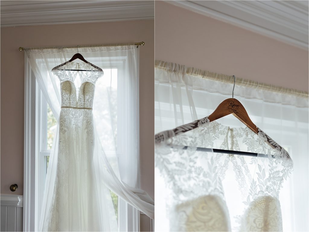 Wedding dress hanging in window frame