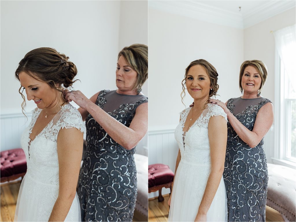 Mother of bride putting a family necklace on the bride